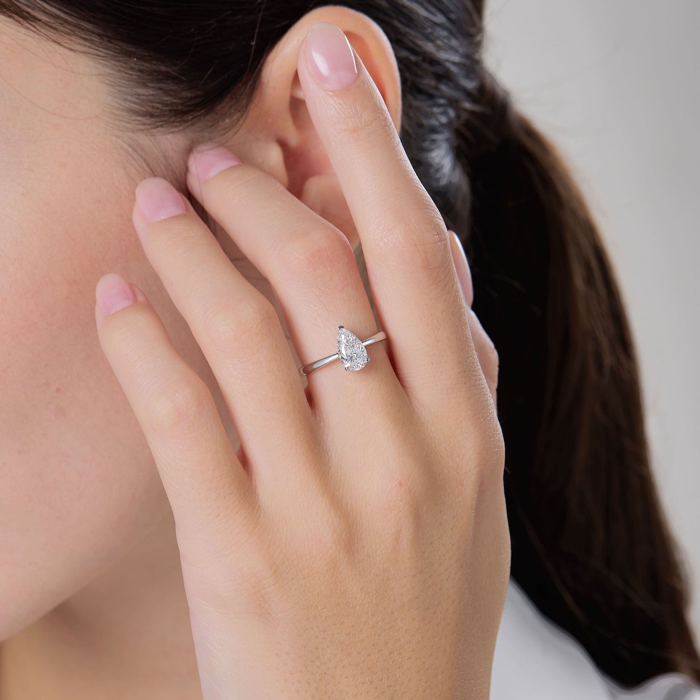 a close up of a person wearing a ring
