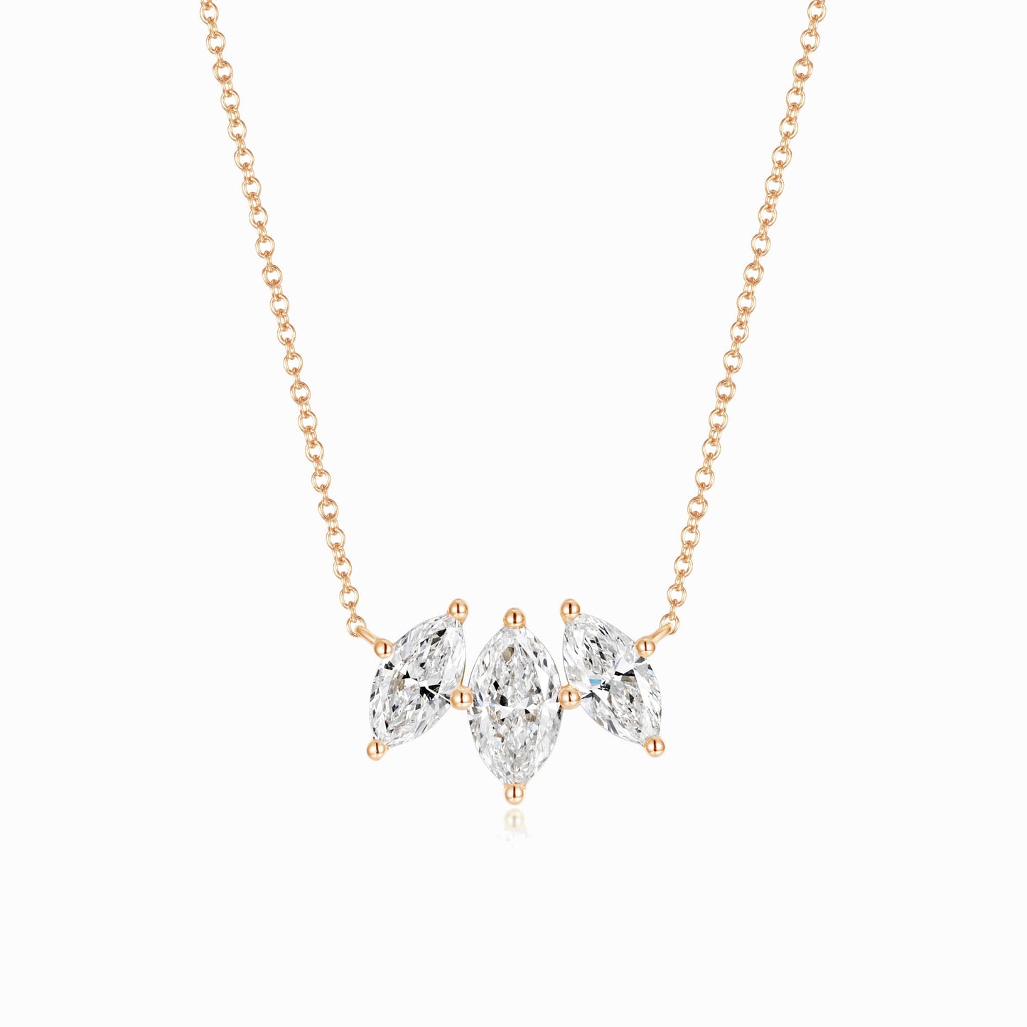 a necklace with three pears on it