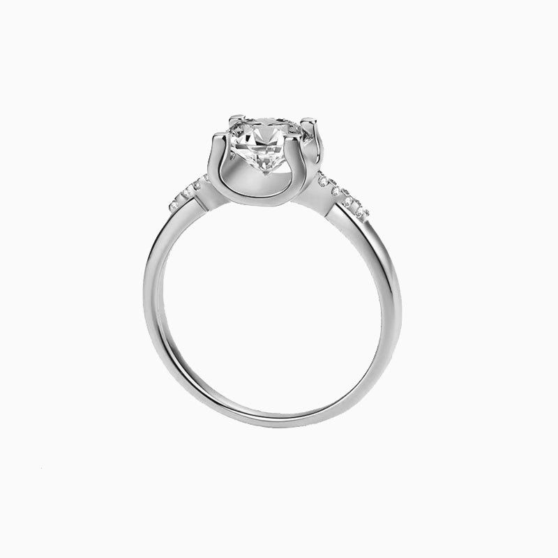 a white gold ring with a diamond center