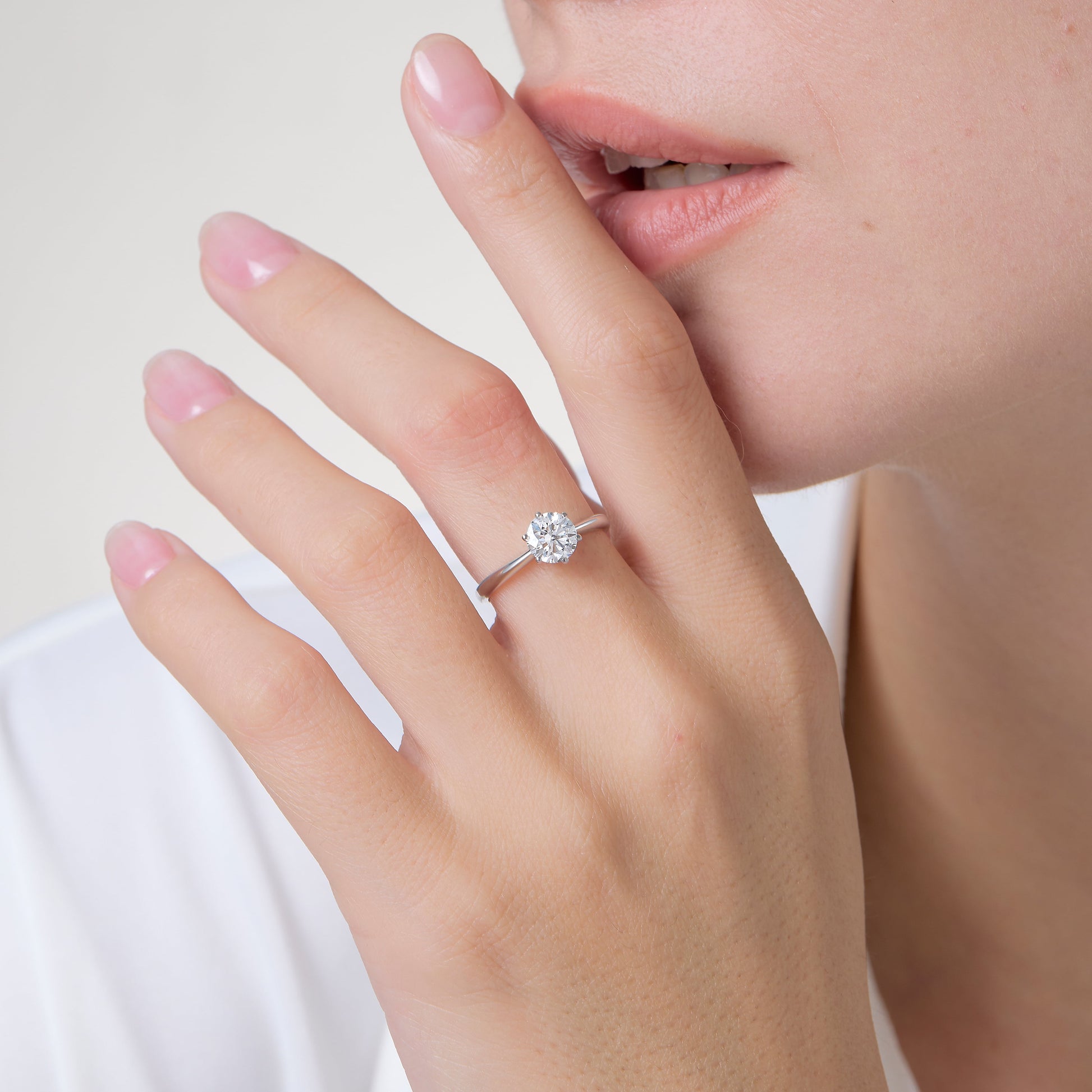 a close up of a person with a ring on their finger