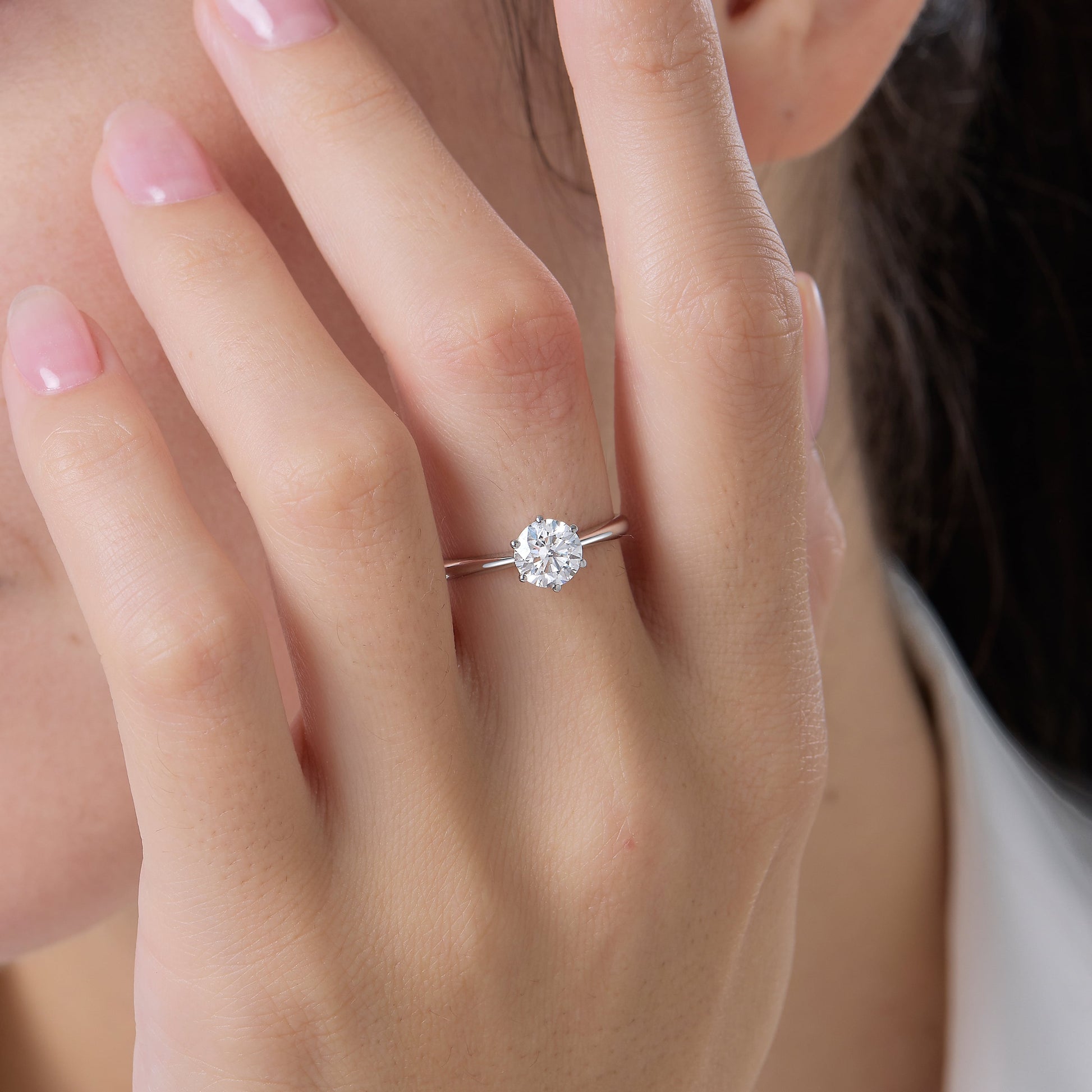 a close up of a person wearing a ring