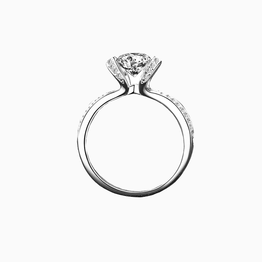 a diamond engagement ring on a white background