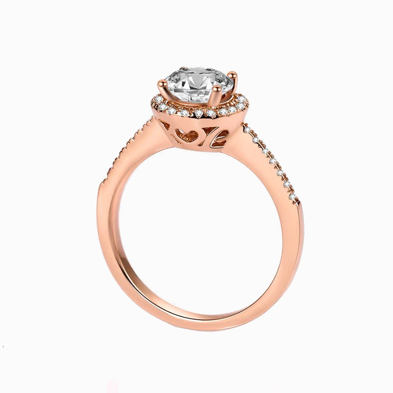 a rose gold engagement ring with a diamond center