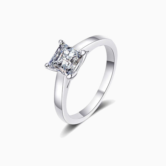 a white gold ring with a princess cut diamond