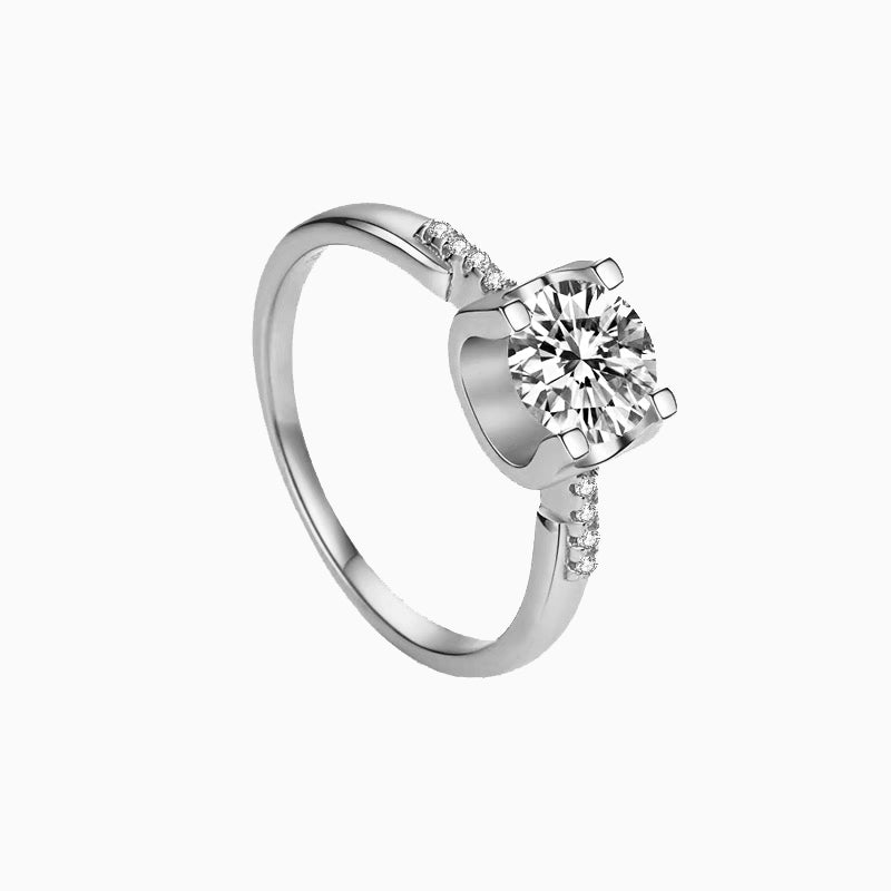 a white gold ring with a single diamond