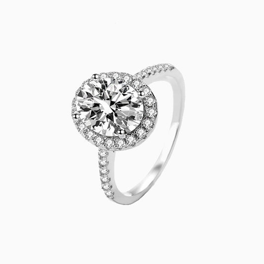 a white gold ring with a diamond center