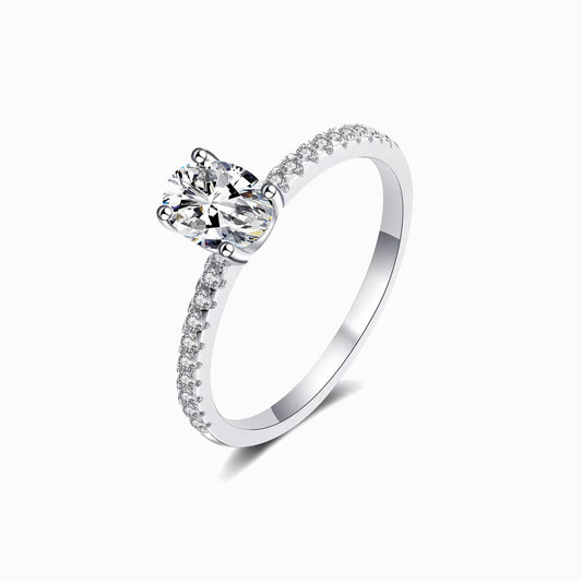 a white gold ring with a single diamond