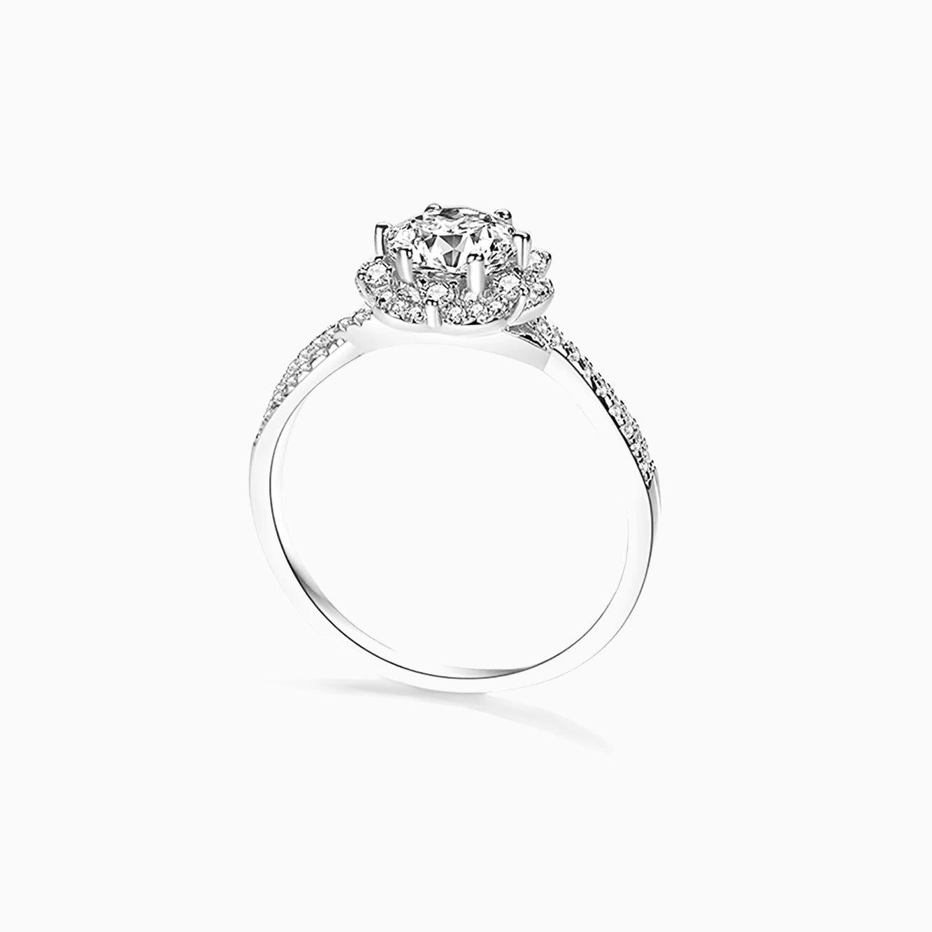 a white gold ring with a diamond center