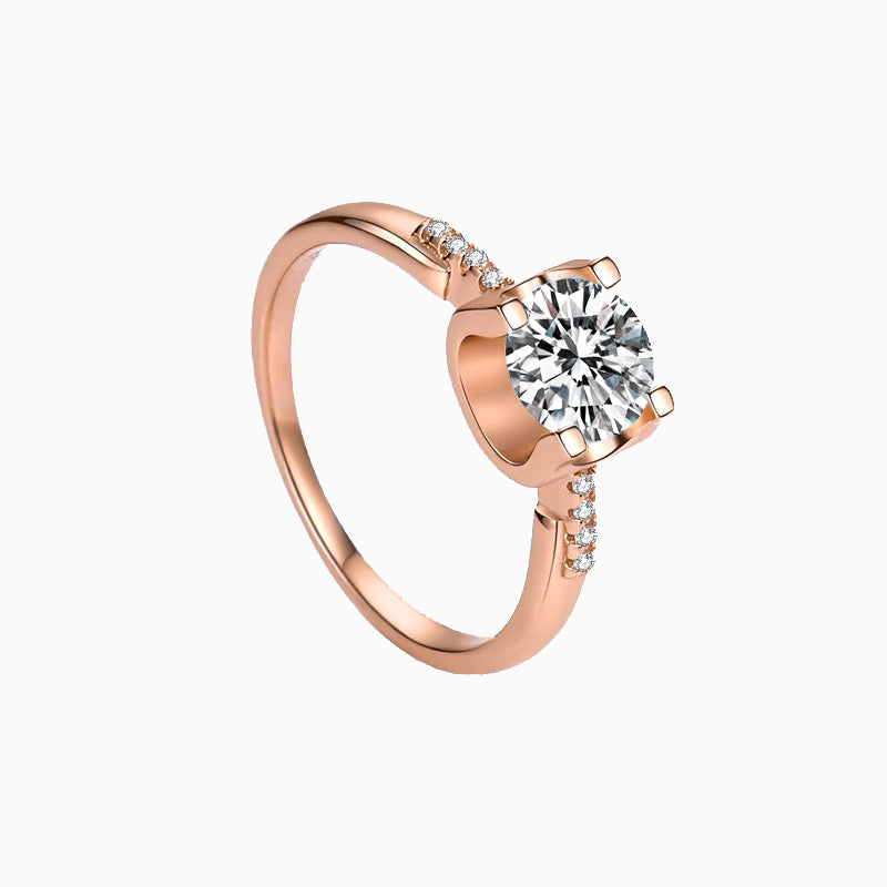 a rose gold engagement ring with a diamond