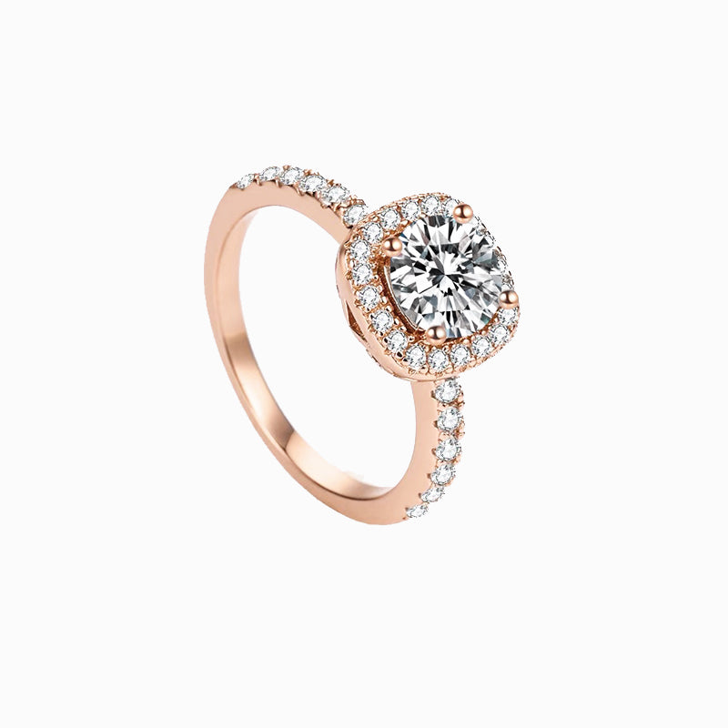 a rose gold ring with a diamond center