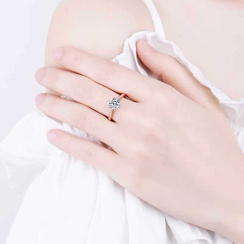 a close up of a person wearing a ring