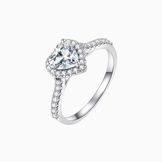 a white gold ring with a heart shaped diamond