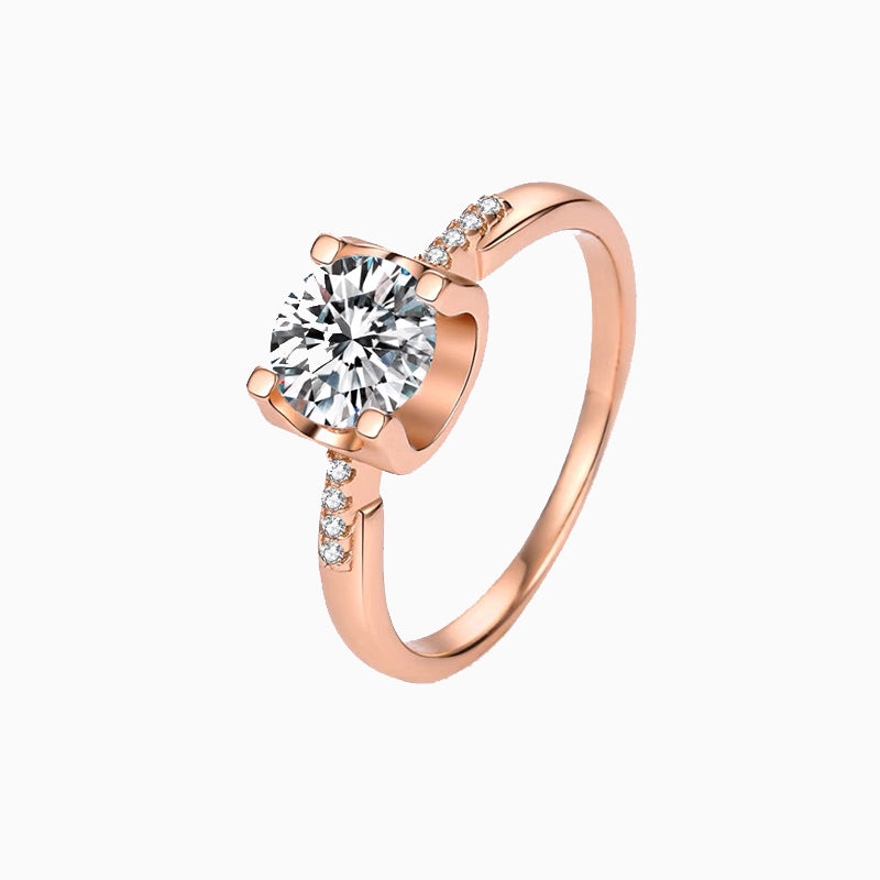 a rose gold engagement ring with a round diamond