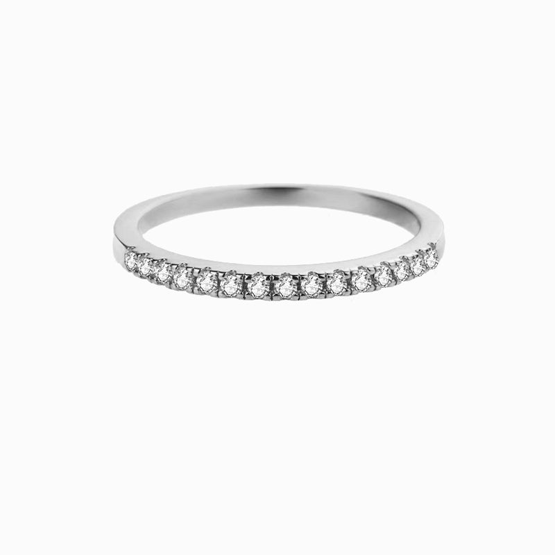 a white gold wedding band with diamonds