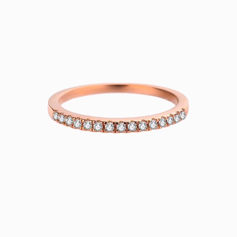 a rose gold band with white diamonds