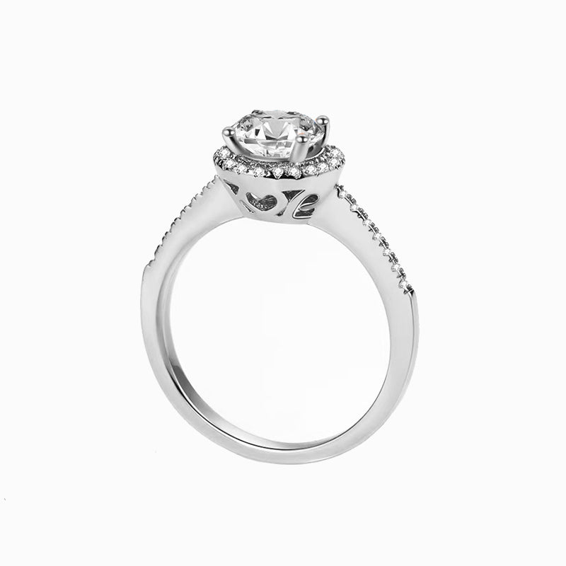 a white gold ring with a diamond center