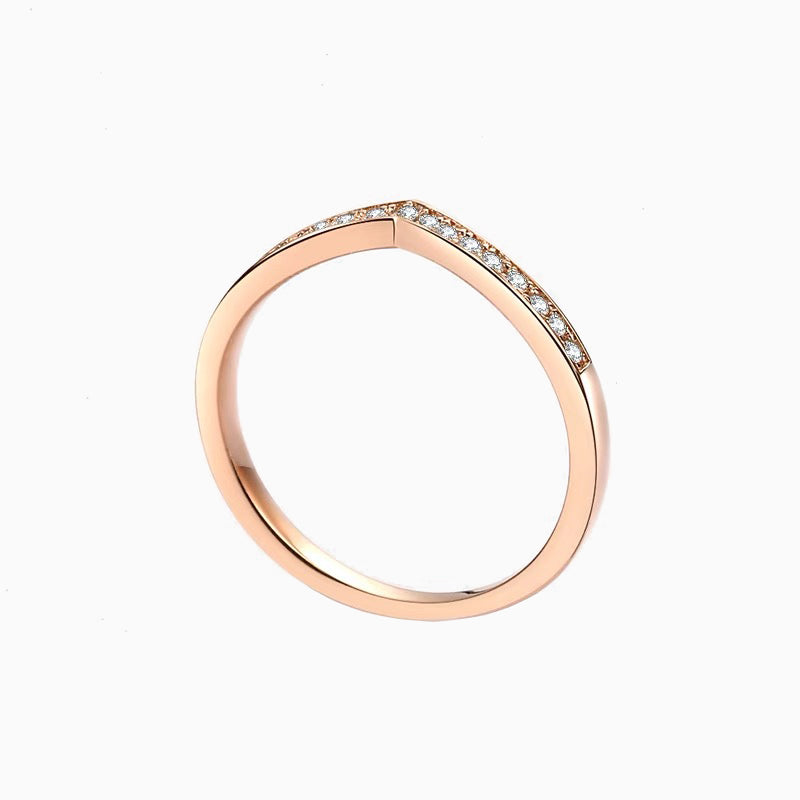 a rose gold ring with diamonds on it