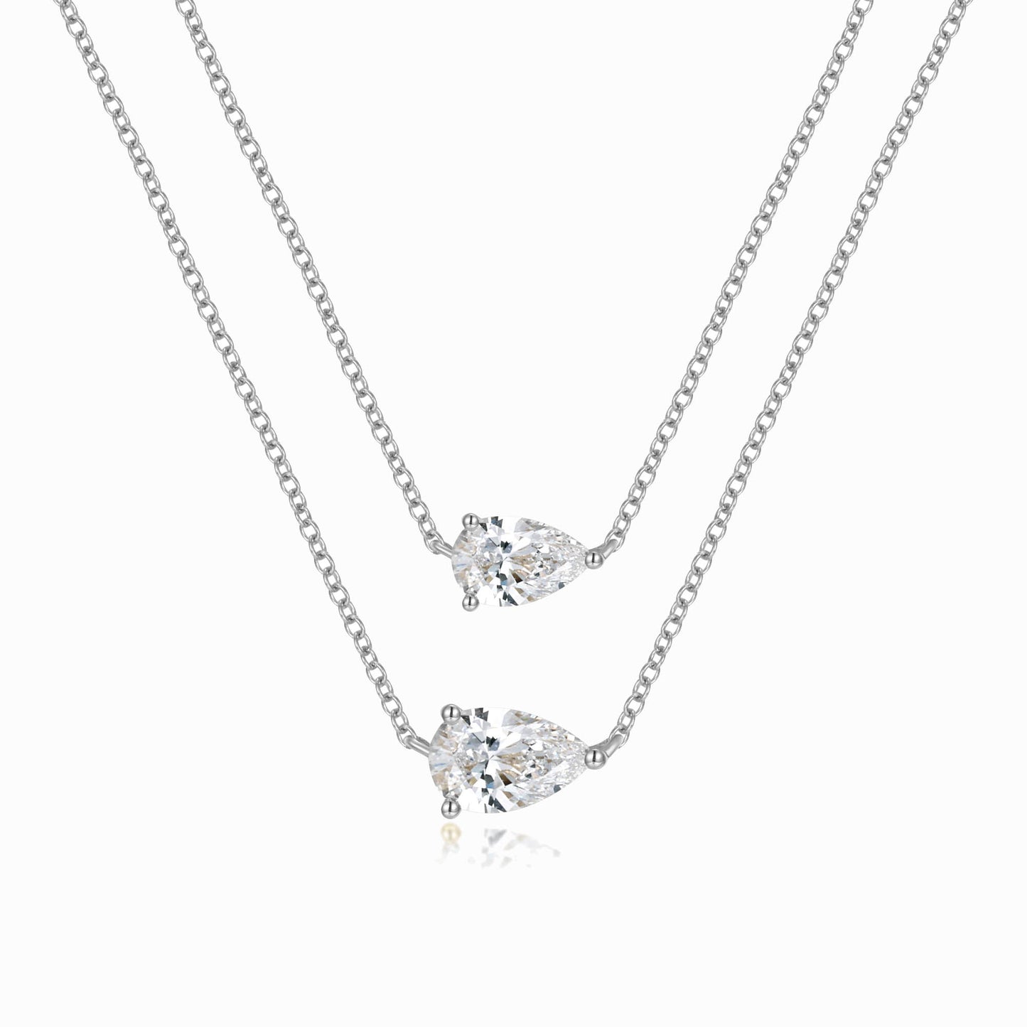 a pair of necklaces on a white background