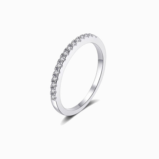 a white gold ring with a row of diamonds