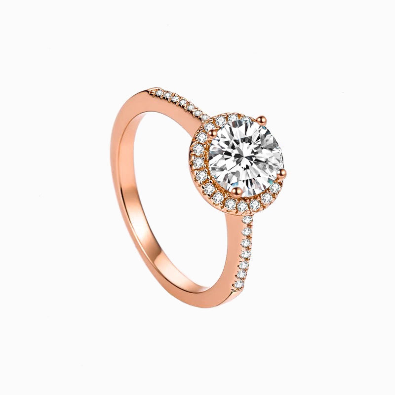 a rose gold engagement ring with a diamond center