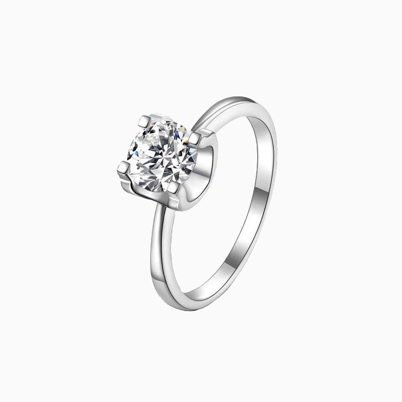 a white gold ring with a single diamond