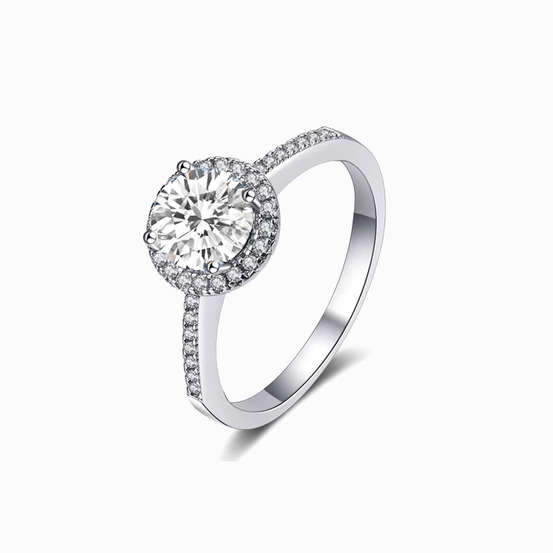 a white gold ring with a diamond center