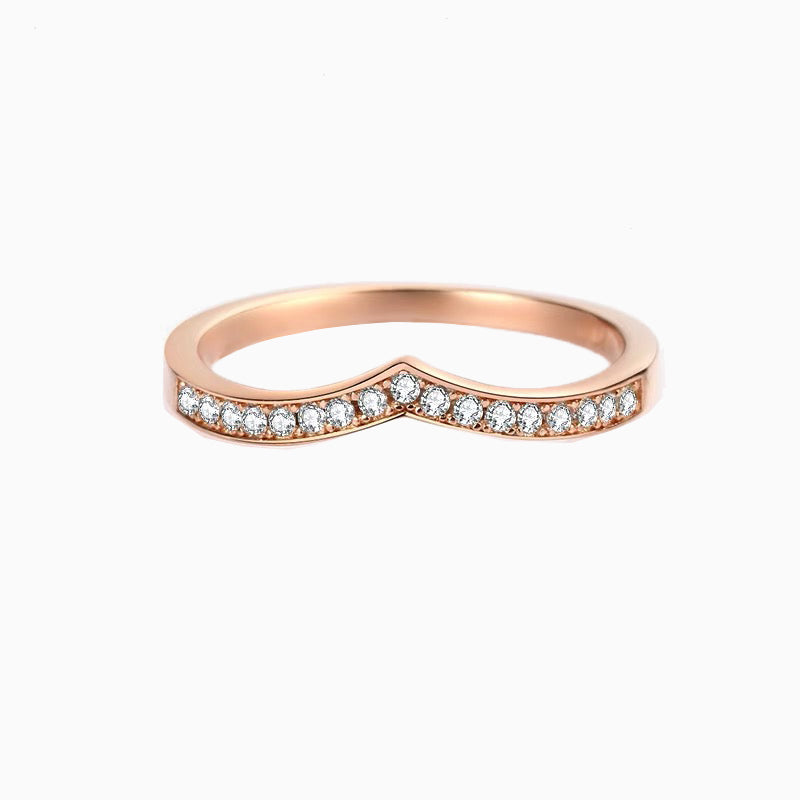 a rose gold ring with a diamond band