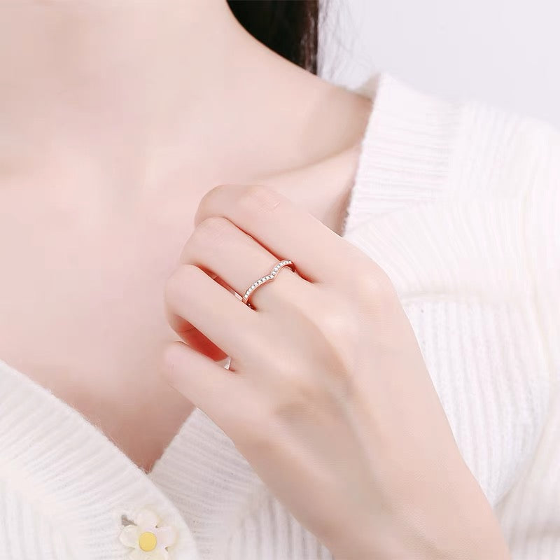 a close up of a person wearing a ring