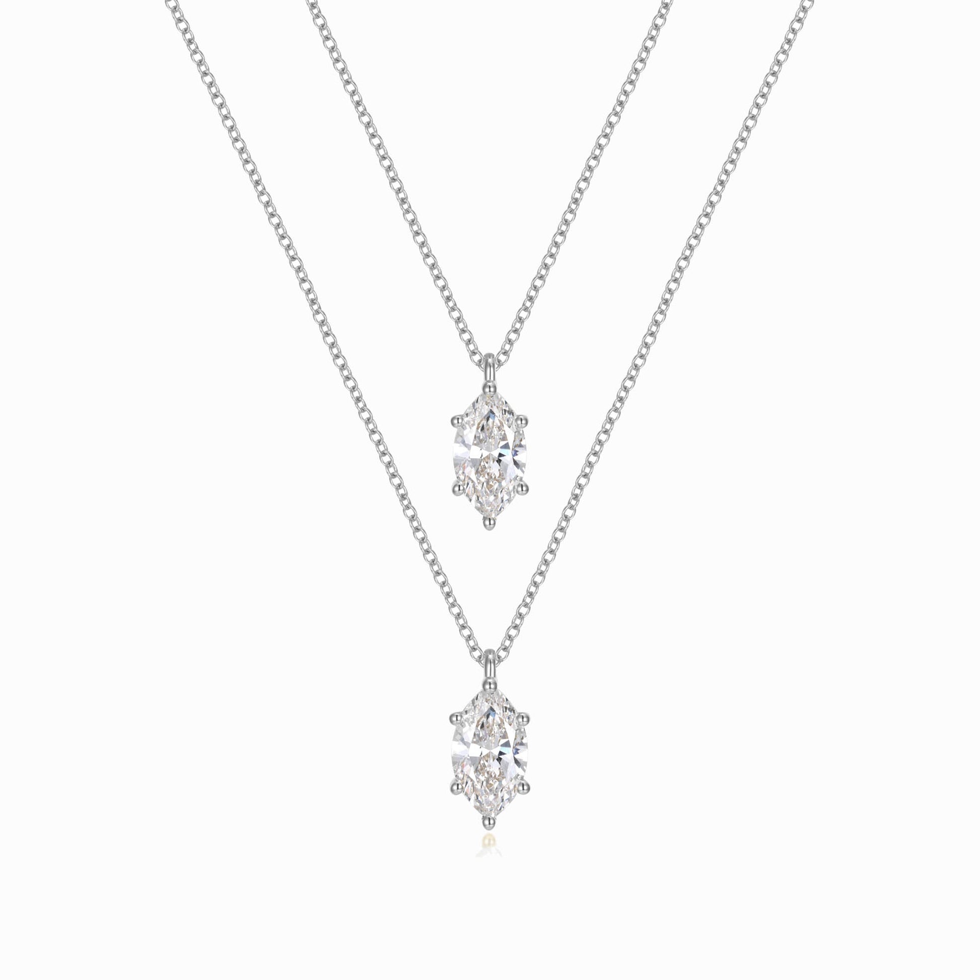 two necklaces with diamonds on a white background