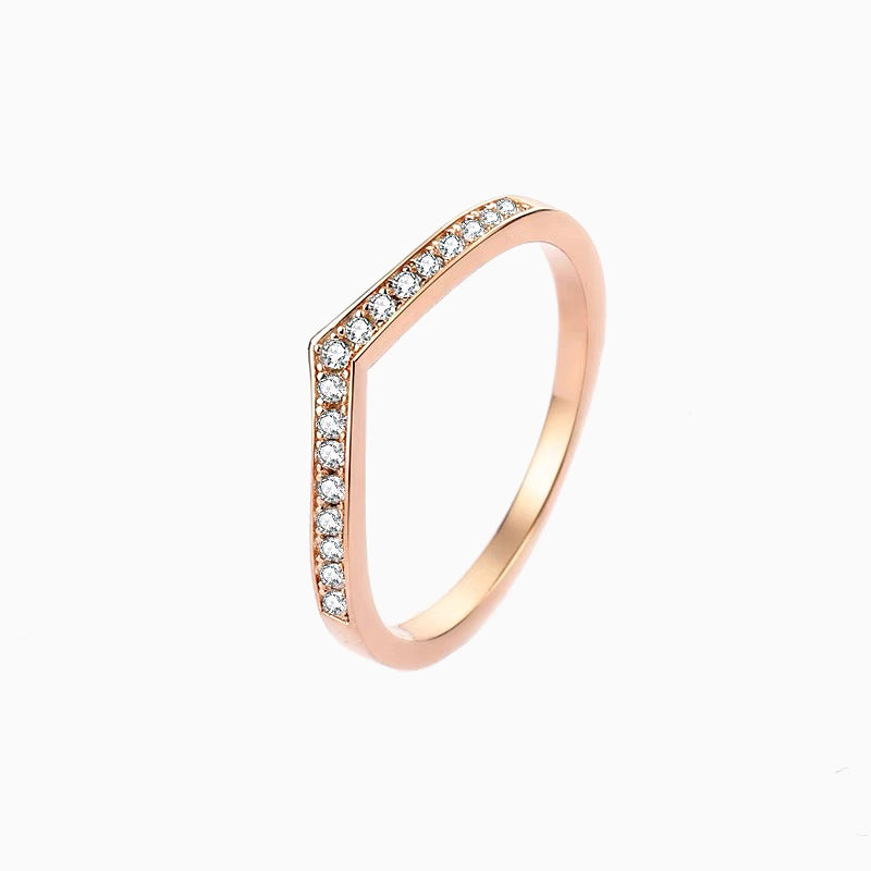 a rose gold ring with diamonds on it