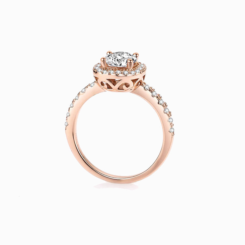 a rose gold engagement ring with a center diamond