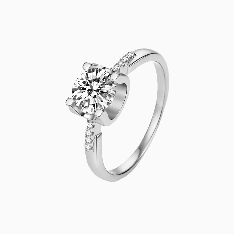 a white gold ring with a single diamond