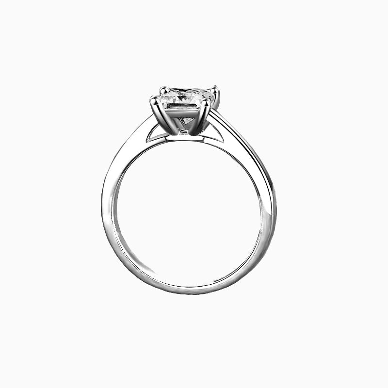 a white gold ring with a princess cut diamond