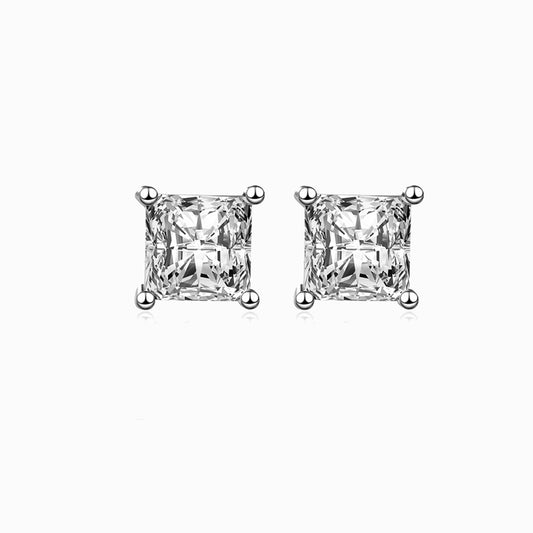 a pair of diamond earrings on a white background