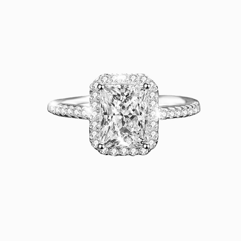 a cushion cut diamond ring with a pave set shoulders